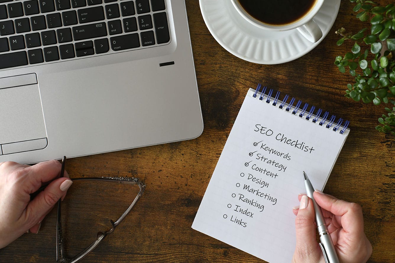 business owner checking off an SEO checklist